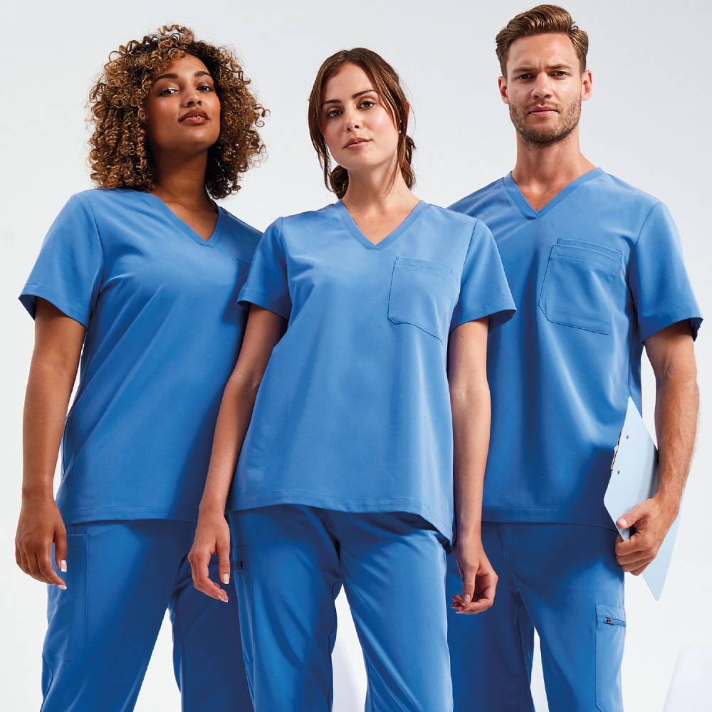 A group of three healthcare professionals, one man and two women, wearing Onna by Premiers Ceil Blue V-neck medical scrub tops, standing together confidently