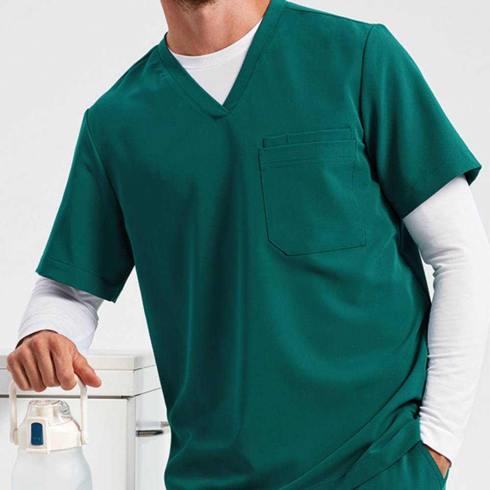 A close up of a male wearing an Onna by Premier Clean Green tunic