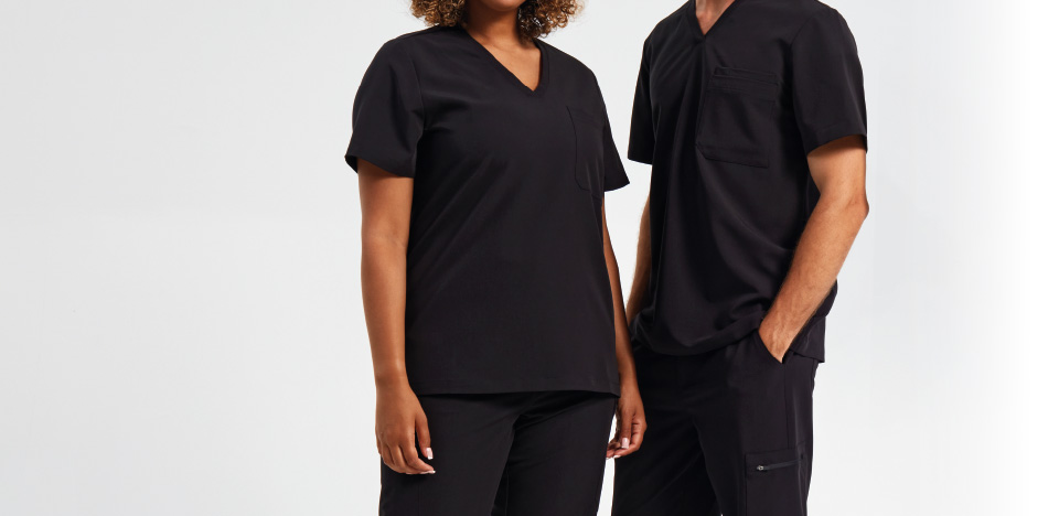 Woman and Man standing side by side wearing Onna by Premier scrubs in Exact Black